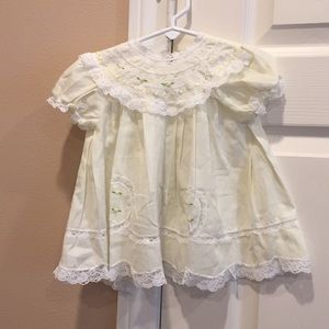 Delicate baby dress with lace trim
